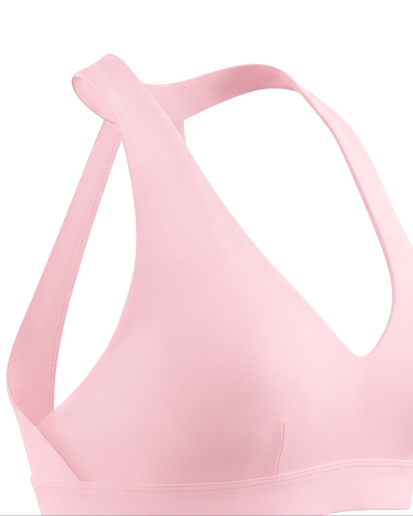 Closeup of side fit and construction on Sculpt Halter Sports Bra in pink