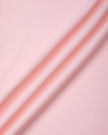 Closeup of smooth nylon-spandex stretch fabric on Sculpt Yoga Pants in pink