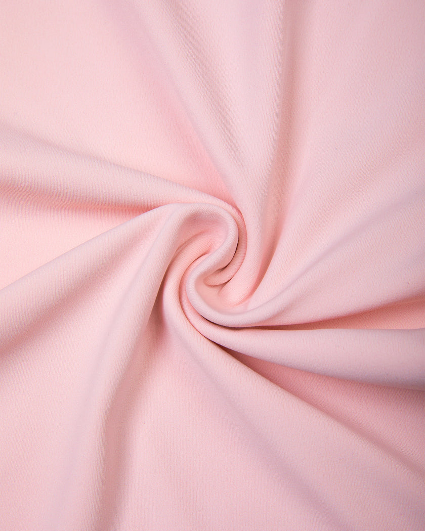 Detailed view of lightweight stretch fabric on Sculpt Yoga Pants in pink
