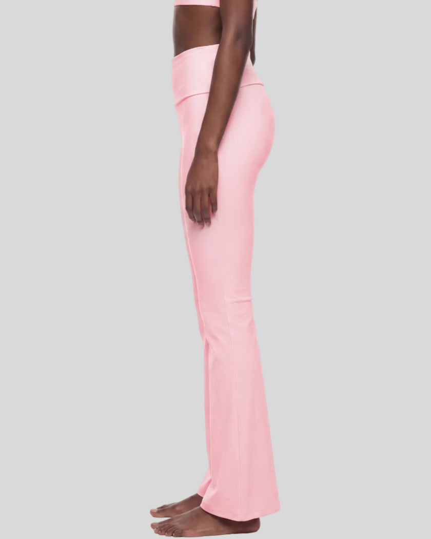 Lower body side view showing the flared silhouette of Sculpt Yoga Pants in pink