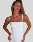 Close-up of square neckline on Athlesi white romper