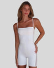 Model wearing Athlesi square neck romper in white front view