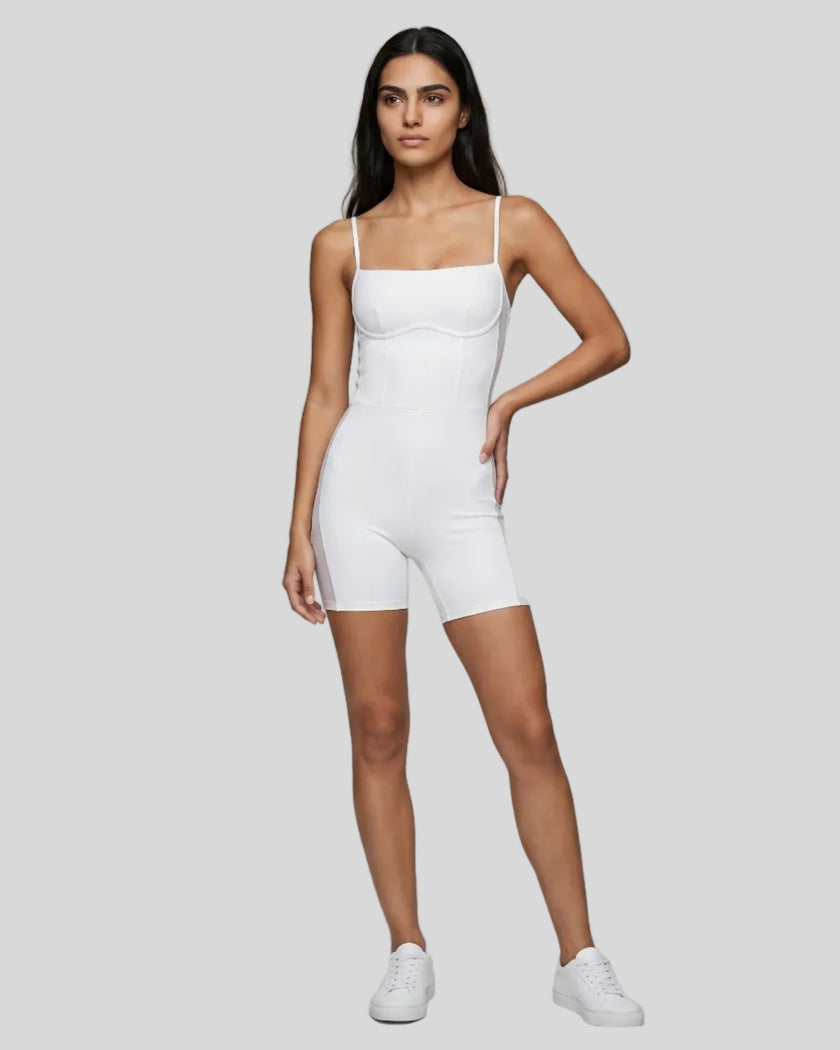 Model wearing Athlesi square neck romper in white full body front