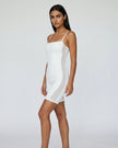 Model wearing Athlesi square neck romper in white side view