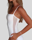 Close-up of sheer side panel detail on Athlesi white romper