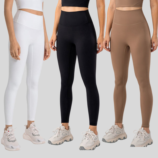 Three models wearing ivory, black and camel SculptlLine High-Waist Leggings on a neutral background