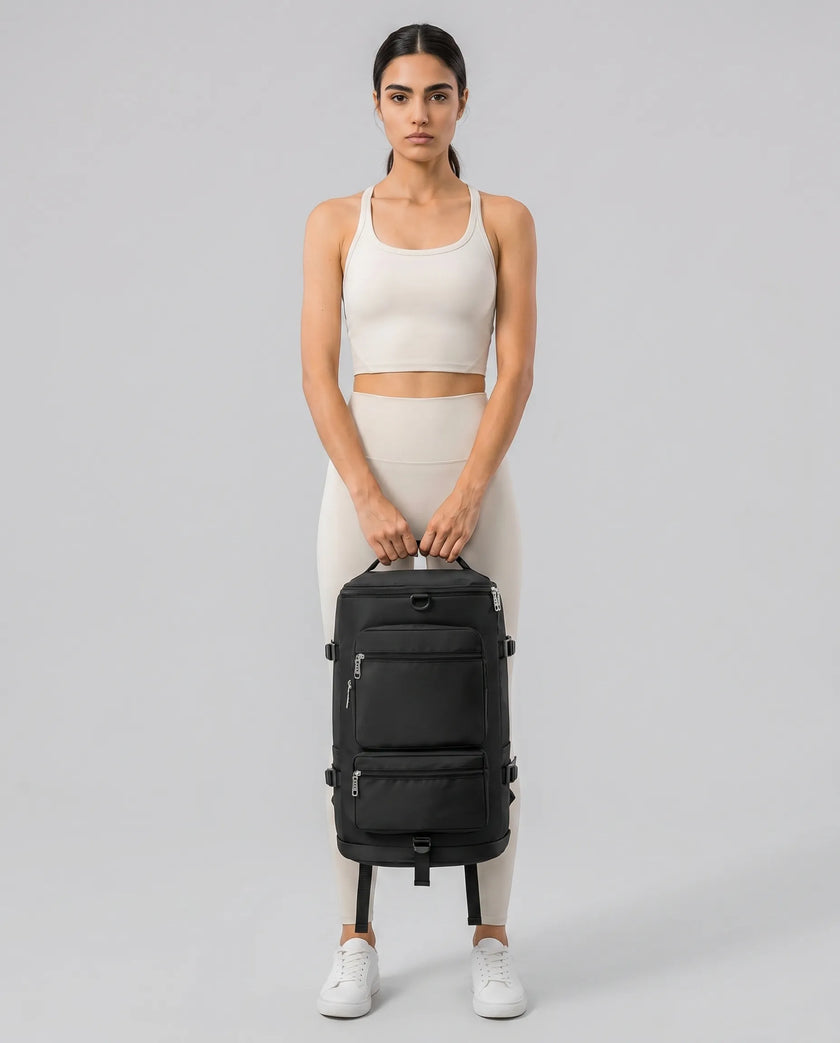Model carrying ShiftForm Carry Pack in black styled for gym and everyday movements