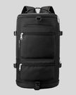 ShiftForm Carry Pack in black shown in vertical position with structured multi-pocket design