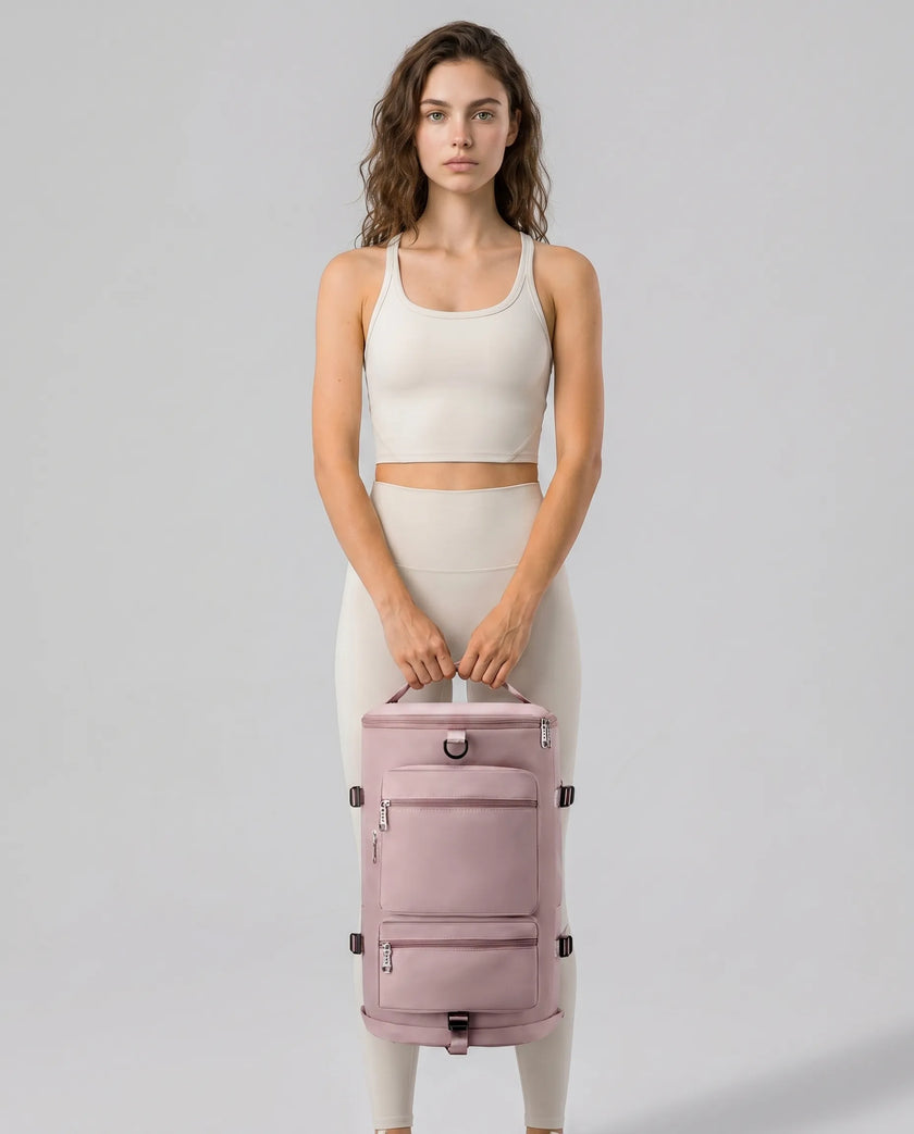 Model carrying ShiftForm Carry Pack in dusty pink styled for gym and everyday movements