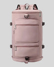 ShiftForm Carry Pack in dusty pink shown in vertical position with structured multi-pocket design