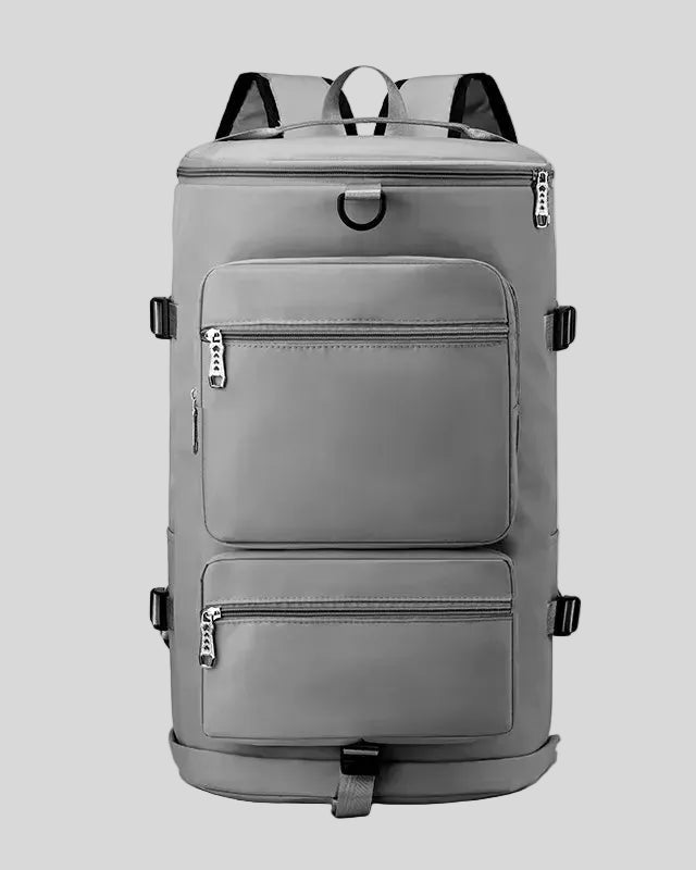 ShiftForm Carry Pack in gray shown in vertical position with structured multi-pocket design