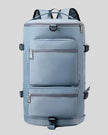 ShiftForm Carry Pack in light blue shown in vertical position with structured multi-pocket design