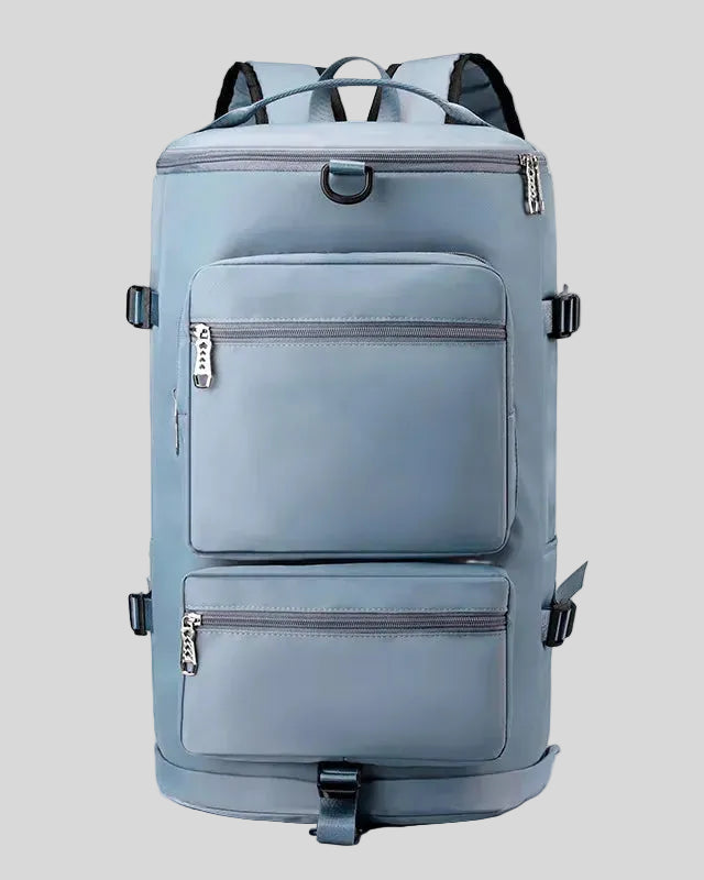 ShiftForm Carry Pack in light blue shown in vertical position with structured multi-pocket design
