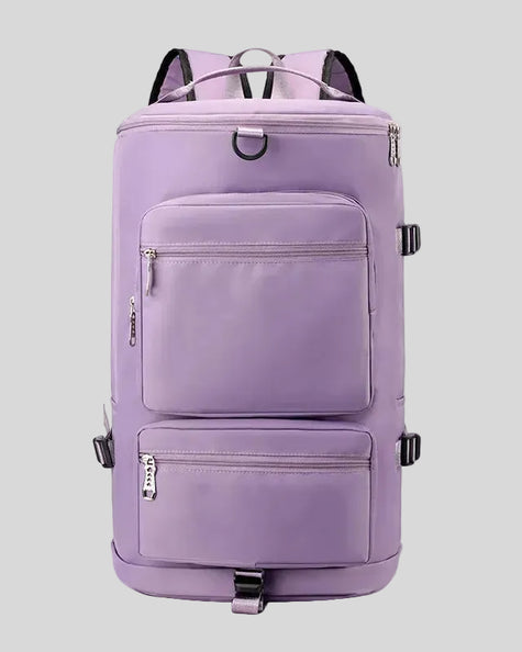 ShiftForm Carry Pack in lilac shown in vertical position with structured multi-pocket design