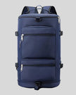 ShiftForm Carry Pack in navy shown in vertical position with structured multi-pocket design