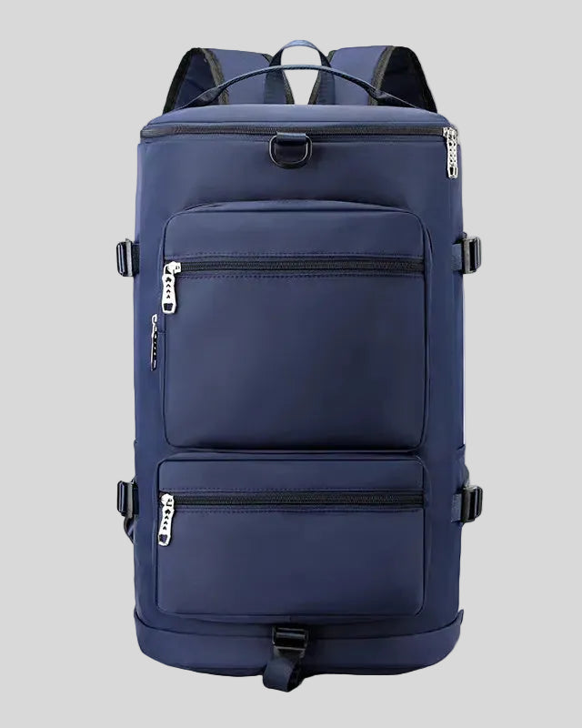 ShiftForm Carry Pack in navy shown in vertical position with structured multi-pocket design