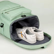 ShiftForm Carry Pack with bottom compartment open showing dedicated shoe storage