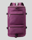 ShiftForm Carry Pack in plum purple shown in vertical position with structured multi-pocket design