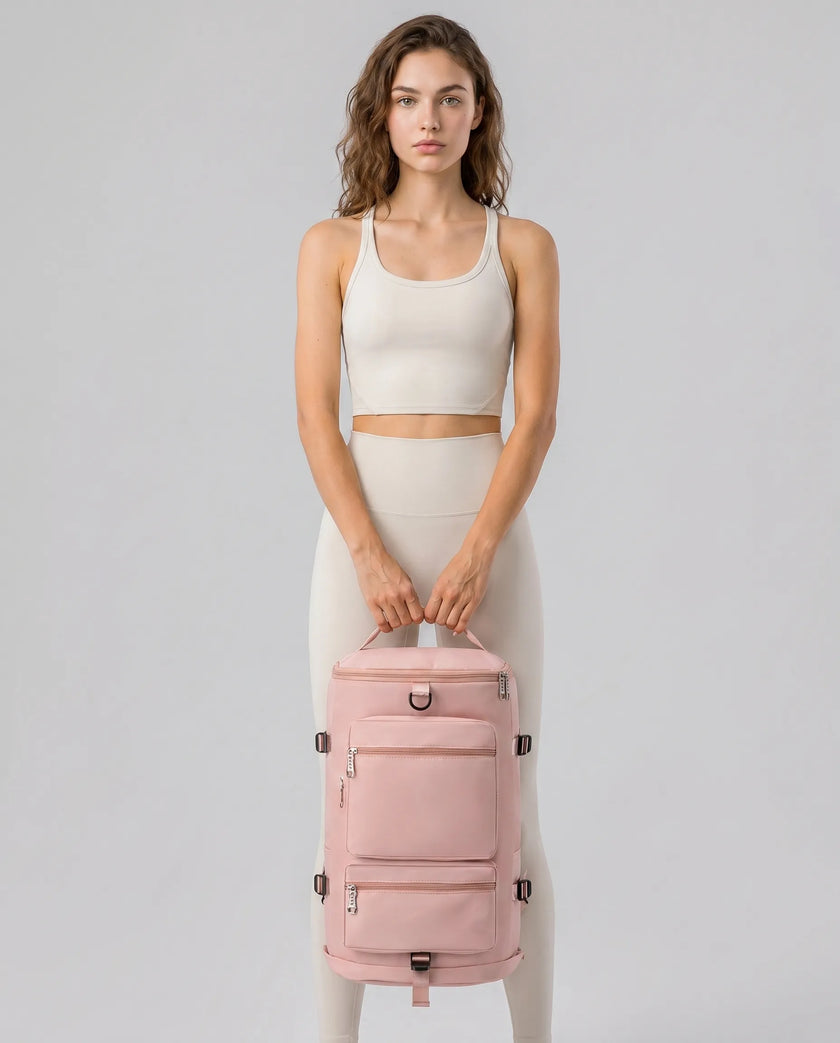 Model carrying ShiftForm Carry Pack in watermelon pink styled for gym and everyday movements