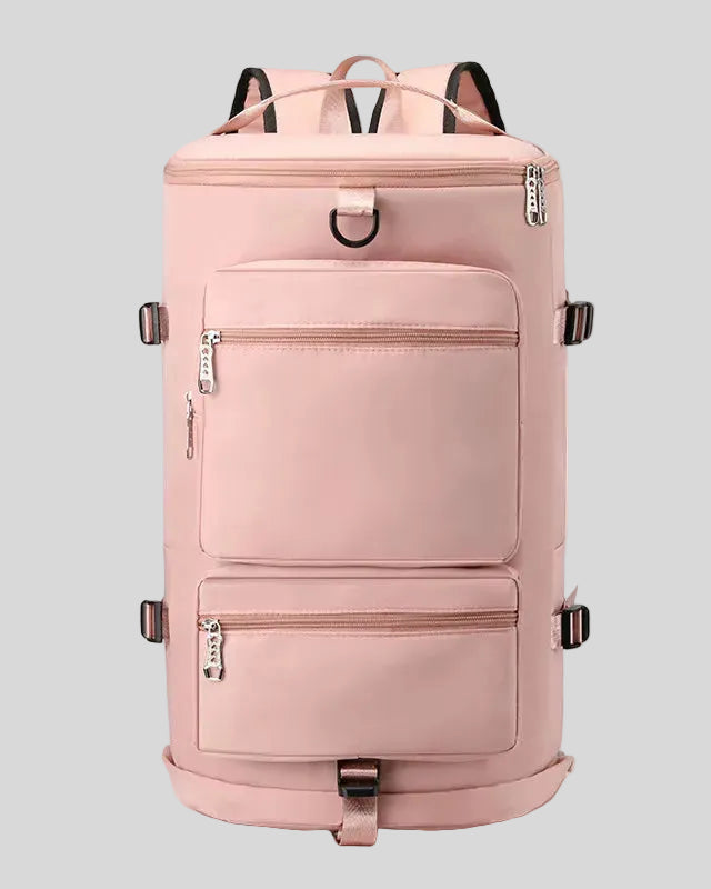 ShiftForm Carry Pack in watermelon pink shown in vertical position with structured multi-pocket design