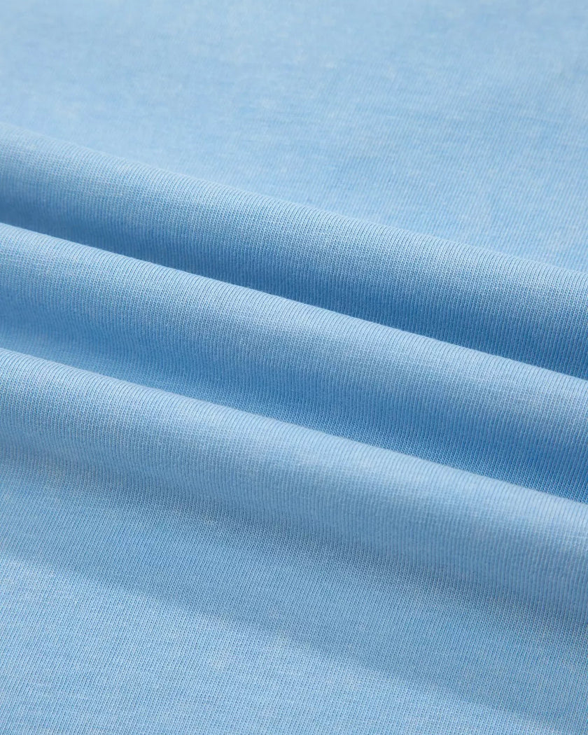 Fabric closeup of the SkyEase Lounge Set in pastel blue showing soft breathable cotton texture