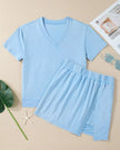 Front flatlay of the SkyEase Lounge Set in pastel blue with V-neck top and matching skort