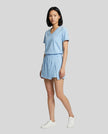 Side view of the SkyEase Lounge Set in pastel blue with relaxed lounge silhouette and matching skort