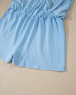 Closeup of the built-in short detail on the SkyEase Lounge Set in pastel blue