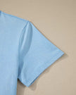Closeup of the short sleeve detail on the SkyEase Lounge Set top in pastel blue