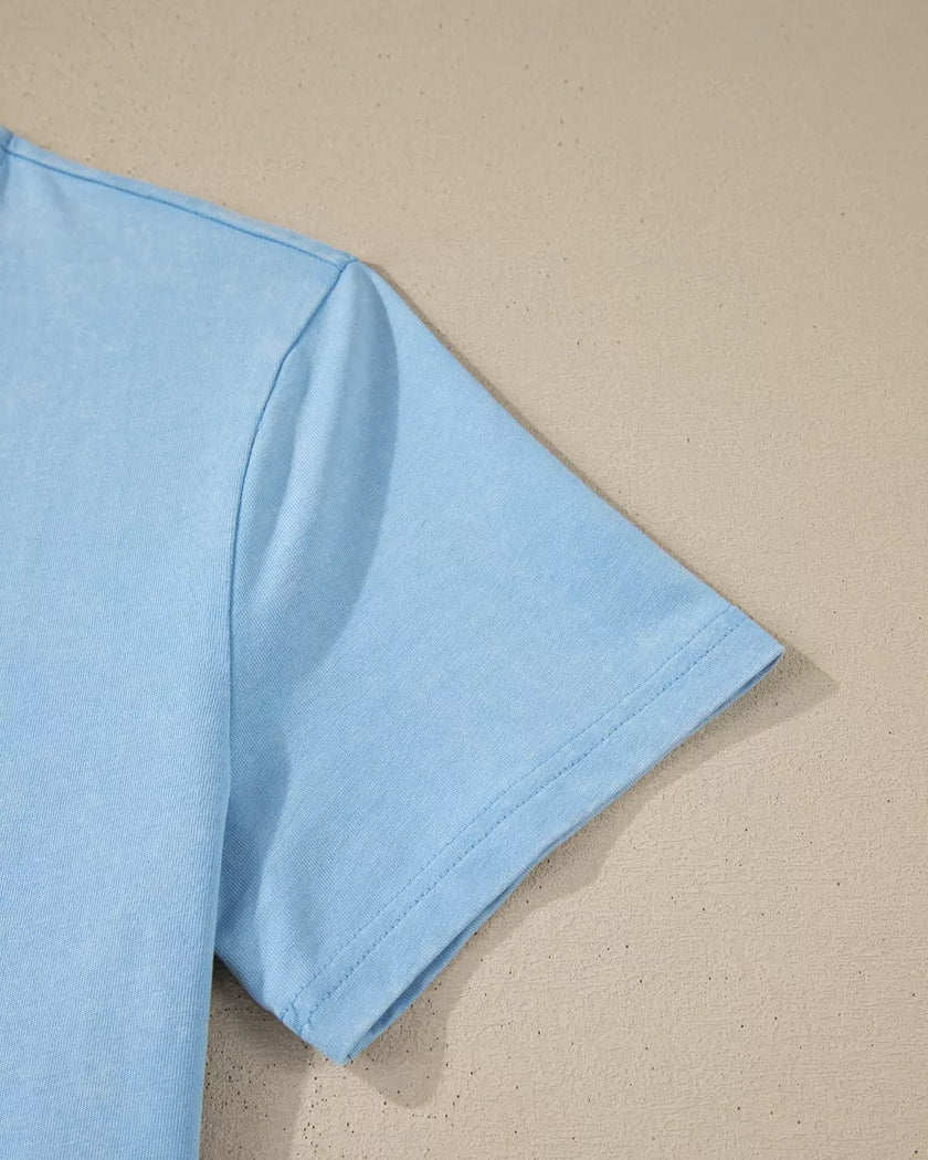 Closeup of the short sleeve detail on the SkyEase Lounge Set top in pastel blue