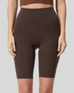 Front view of Athlesi SmoothForm Seamless Biker Short in dark brown with wide waistband