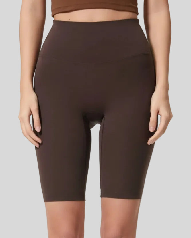 Front view of Athlesi SmoothForm Seamless Biker Short in dark brown with wide waistband