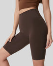 Left side view of dark brown biker short length and sculpted fit