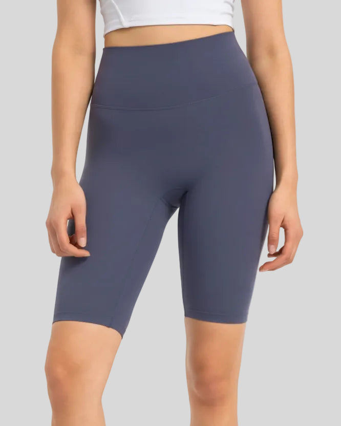 Front view of Athlesi SmoothForm Seamless Biker Short in dusty blue with wide waistband