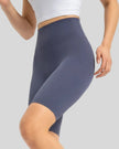 Left side view of dusty blue biker short length and sculpted fit