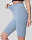 Left side view of light blue biker short length and sculpted fit