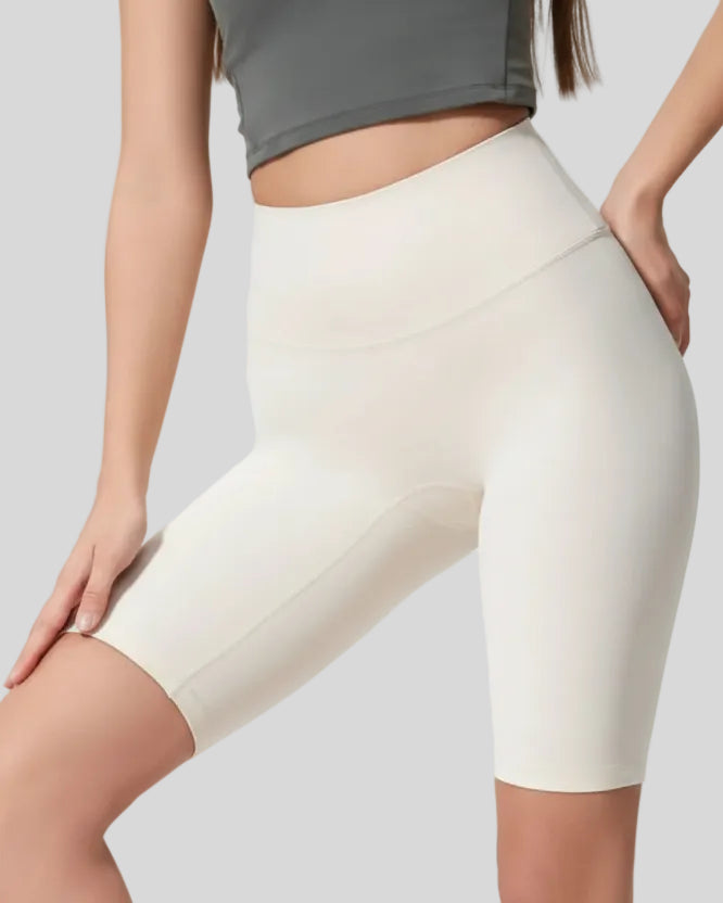 Angled front view showing smooth fit and biker length in white