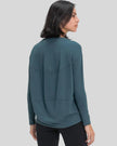 Back view of Athlesi SoftFlow relaxed long sleeve top in deep teal