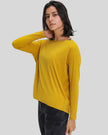 Side view of Athlesi SoftFlow relaxed long sleeve active top in mustard