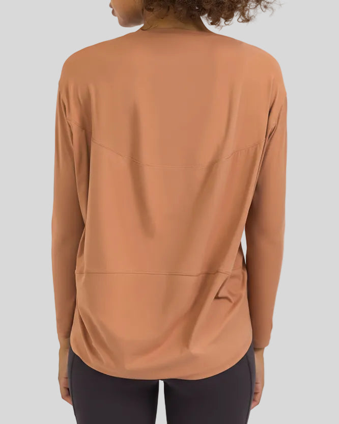 Back view of Athlesi SoftFlow relaxed long sleeve top in sherbet