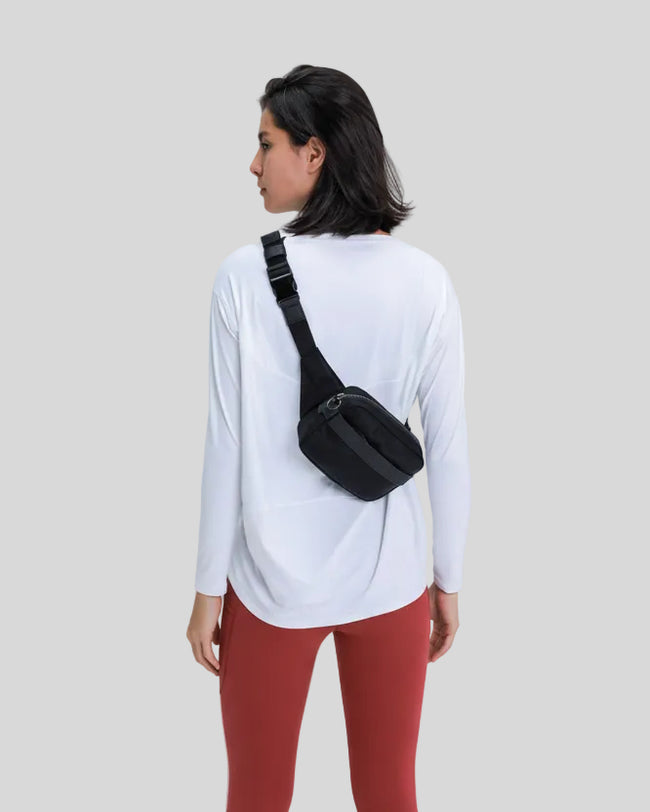 Back view of Athlesi SoftFlow relaxed long sleeve top in white