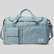 SoftForm Carry Bag in air force blue with quilted texture and structured design