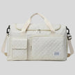 SoftForm Carry Bag in beige with quilted texture and structured design