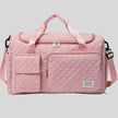 SoftForm Carry Bag in dusty pink with quilted texture and structured design