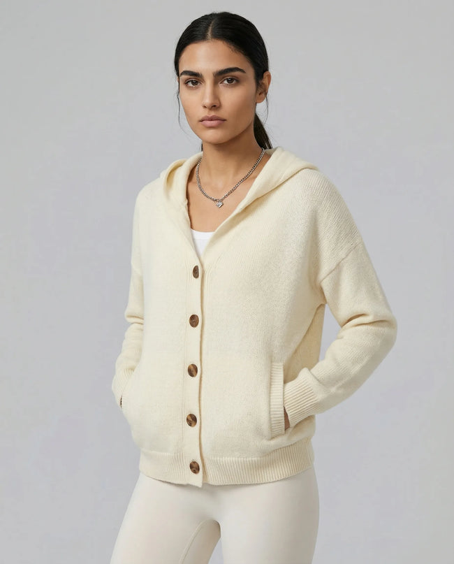 Model wearing an apricot SoftForm Hooded Cardigan with buttons on a neutral setting