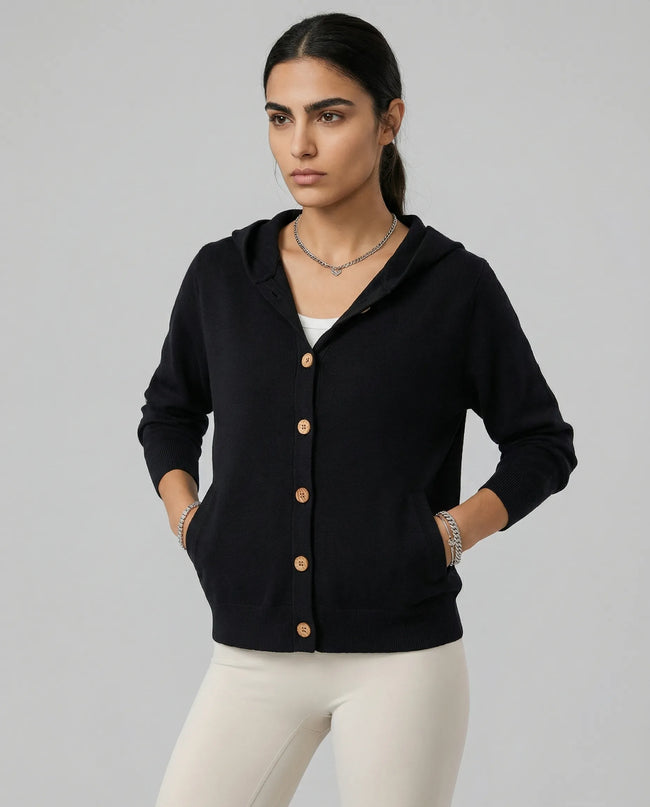 Model wearing a black SoftForm Hooded Cardigan with buttons on a neutral setting