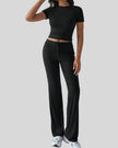Front angled view of model wearing black Athlesi SoftForm lounge set