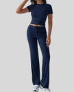 Front angled view of model wearing dark blue Athlesi SoftForm lounge set
