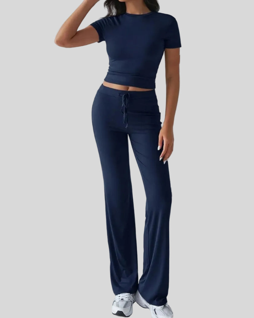 Front angled view of model wearing dark blue Athlesi SoftForm lounge set