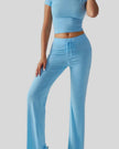 Front angled view of model wearing pastel blue Athlesi SoftForm lounge set